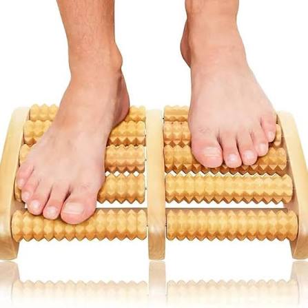 Handcrafted wooden foot massager with textured rollers